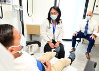pediatrician with parent and child in a medical exam room